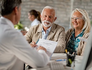 elderly couple at a consultation with their dentist 