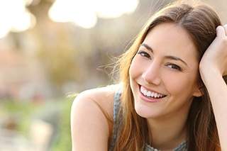Woman smiling after dental bonding treatment