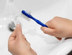 Brushing a nightguard in the sink