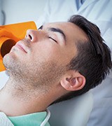 Man relaxing in dental chair