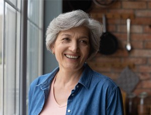 Senior woman smiling with dentures