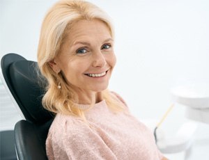 Woman smiling in the dental chair