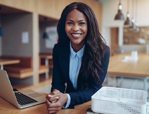 Woman smiling after getting cosmetic dentistry in Plano