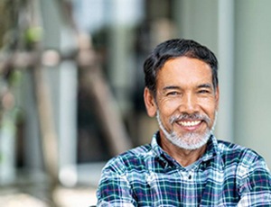 man smiling with dental implants in Plano