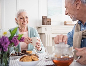 elderly couple eating together