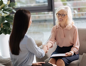 mature woman smiling during job interview