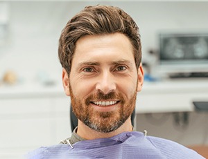 Male dental patient with beard waiting for treatment
