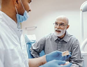 man at an implant denture consultation 