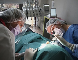 a dentist placing dental implants