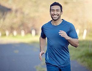 a man smiling while running