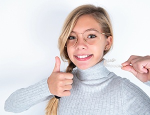 Plano teen smiling with Invisalign Teen