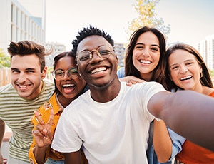 Plano teen taking selfie with friends
