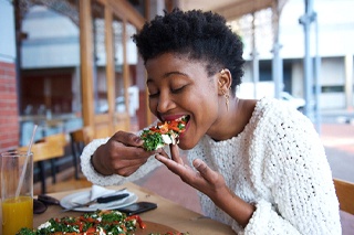 person eating pizza