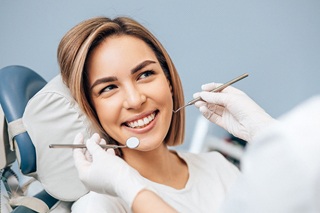 Happy, young female patient enjoying Saturday dental services