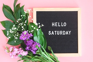 Pretty letterboard and flowers promoting Saturday dentistry in Plano