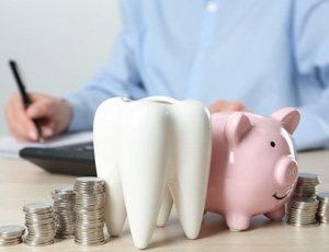 Coins next to a piggy bank