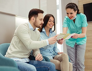 Patient in Plano talking to their dentist about financing