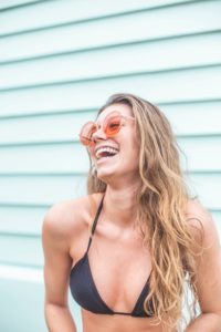 Woman in bathing suit with attractive smile